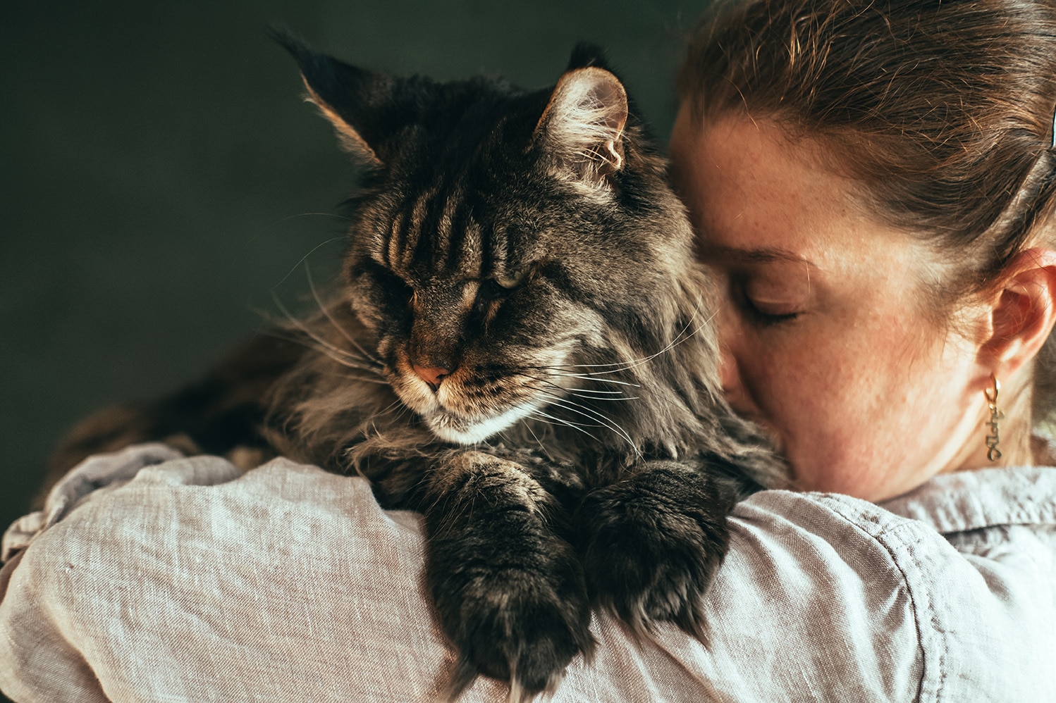 woman holding her cat before In-Home Euthanasia Services in Nashville, TN